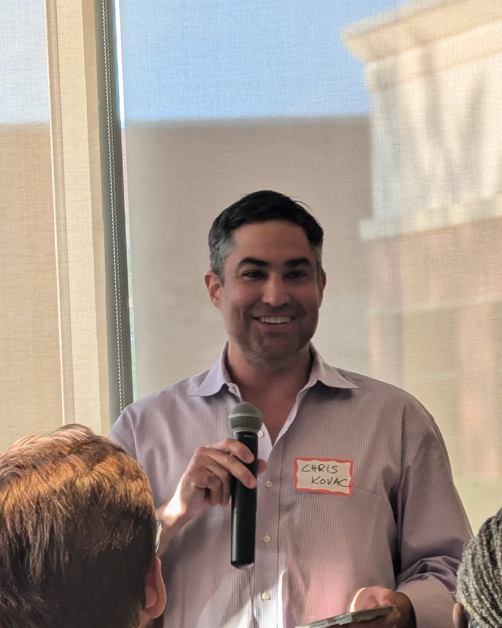 Chris Kovac speaking at a Kansas City AI Club event
