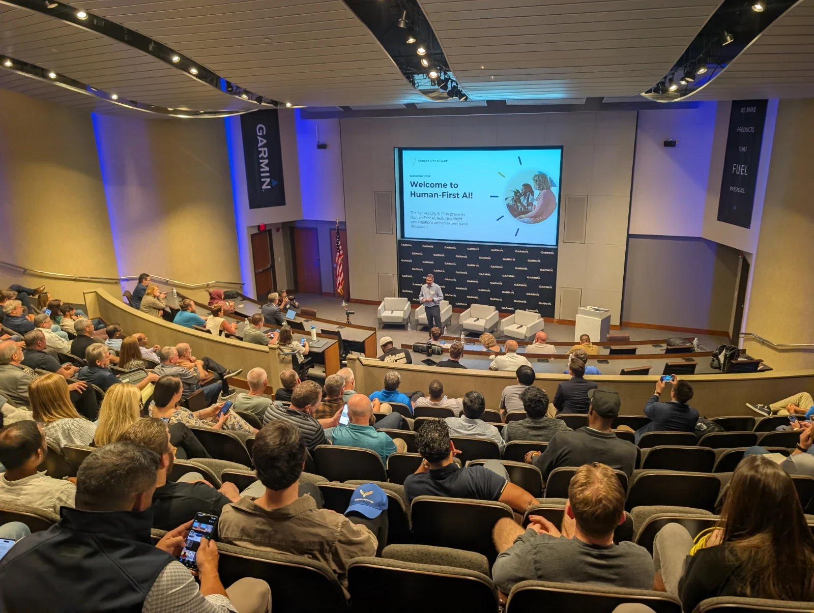 Chris Kovac opening a Kansas City AI Club event at Garmin for a full auditorium